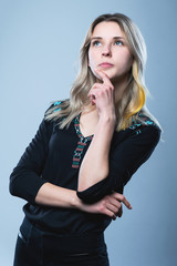 Fototapeta premium Closeup portrait of a girl, on an isolated gray background. Human face expression, emotions, feeling attitude reaction