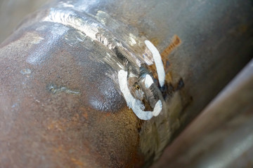 Weld inspection Weld defect. Defective welded butt seam of the pipeline and branch Du50.