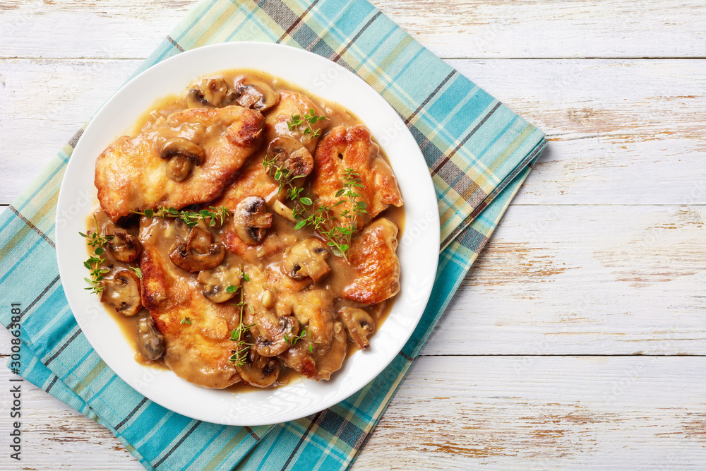 Wall mural rustic style of chicken marsala on a plate