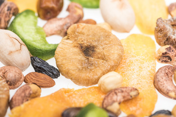close up view of Turkish assorted nuts, dried fruits and candied fruit isolated on white