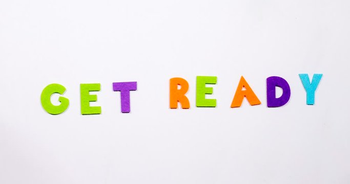 The word get ready. The word is written in dancing font.