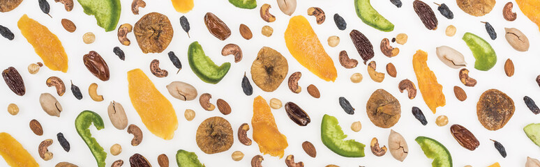 top view of assorted nuts, dried fruits and candied fruit isolated on white, panoramic shot