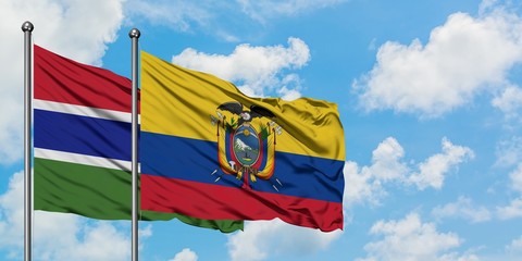 Gambia and Ecuador flag waving in the wind against white cloudy blue sky together. Diplomacy concept, international relations.