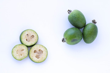 Closeup feijoa group of fruits and sliced isolated at white background. Scientific name Acca sellowiana, Organic and clean food. Healthy and balanced diet eating concept.Fresh fruits concept.