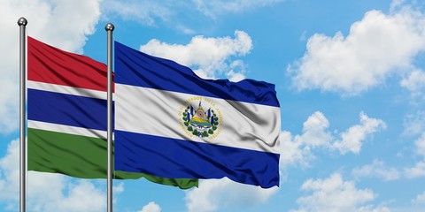 Gambia and El Salvador flag waving in the wind against white cloudy blue sky together. Diplomacy concept, international relations.