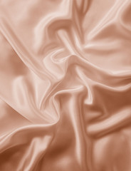 Beautiful smooth elegant wavy beige / light brown satin silk luxury cloth fabric texture, abstract...