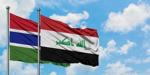 Gambia and Iraq flag waving in the wind against white cloudy blue sky together. Diplomacy concept, international relations.