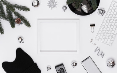 Top view of white desk with mockup paper calendar for January and decorative stuff. christmas and happy new year.