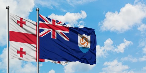 Georgia and Anguilla flag waving in the wind against white cloudy blue sky together. Diplomacy concept, international relations.