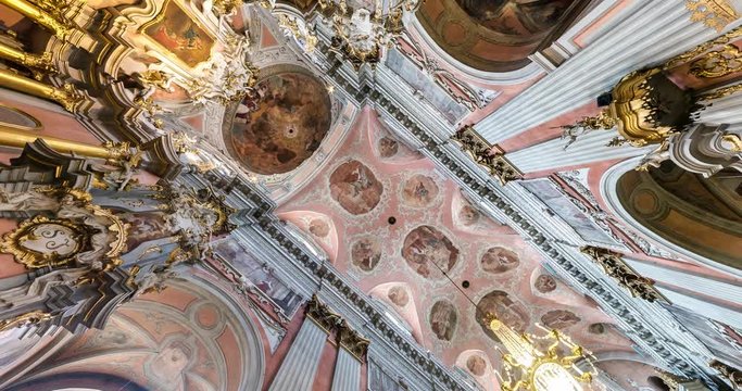 spinning and torsion of interior view and Looking up into baroque church Dome