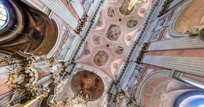 spinning and torsion of interior view and Looking up into baroque church Dome