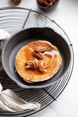 Pancakes with banana, walnuts and honey. Morning concept