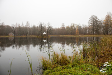 Autumn panorama of the pond with a gazebo in the Park with oaks. Smolensk region, Russia.