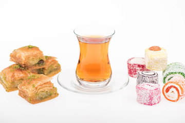 cup of tea near baklava, turkish delight isolated on white