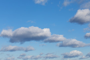 Heavenly bright blue sky with white, fluffy could. Background from clouds.