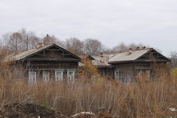 abandoned old wooden house in autumn