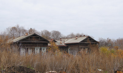 abandoned old wooden house in autumn
