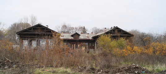 abandoned old wooden house in autumn