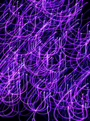 Purple lilac blue abstract looped lines on a black background. Abstraction