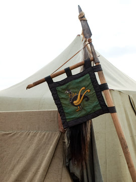 Historic medieval festival, camp Viking, a pennant with the image of a runic sign.
