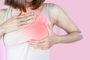 Asian woman checking her breast ,self cancer examination concept