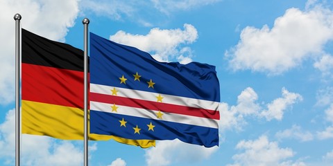 Germany and Cape Verde flag waving in the wind against white cloudy blue sky together. Diplomacy concept, international relations.