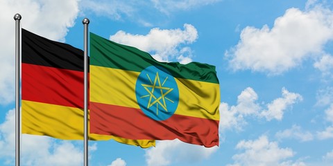 Germany and Ethiopia flag waving in the wind against white cloudy blue sky together. Diplomacy concept, international relations.