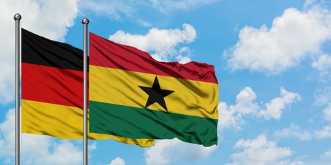 Germany and Ghana flag waving in the wind against white cloudy blue sky together. Diplomacy concept, international relations.