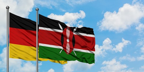 Germany and Kenya flag waving in the wind against white cloudy blue sky together. Diplomacy concept, international relations.