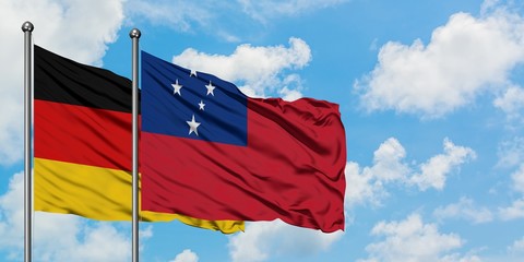 Germany and Samoa flag waving in the wind against white cloudy blue sky together. Diplomacy concept, international relations.