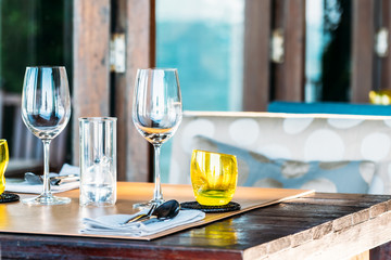 Wine glass with dining set prepare for breakfast lunch or dinner on table in restaurant