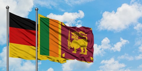Germany and Sri Lanka flag waving in the wind against white cloudy blue sky together. Diplomacy concept, international relations.