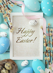 greeting card in frame with easter eggs and spring flowers