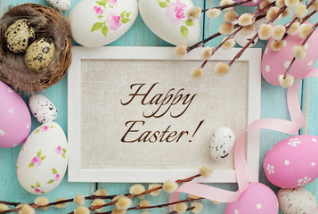 greeting card in frame with easter eggs and spring flowers
