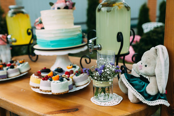 Cake with berries and fruits on a festively decorated table