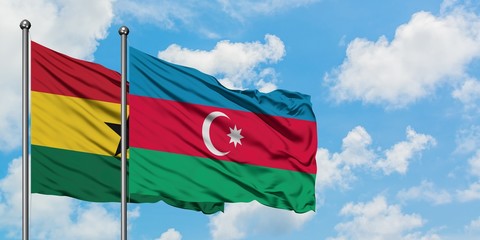 Ghana and Azerbaijan flag waving in the wind against white cloudy blue sky together. Diplomacy...