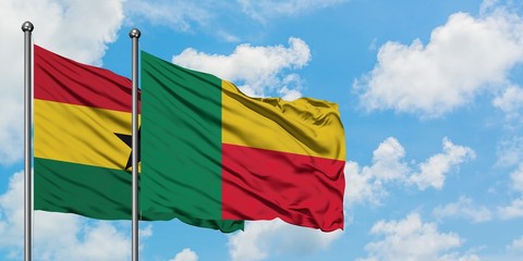 Ghana and Benin flag waving in the wind against white cloudy blue sky together. Diplomacy concept, international relations.