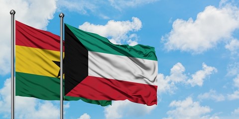 Ghana and Kuwait flag waving in the wind against white cloudy blue sky together. Diplomacy concept,...
