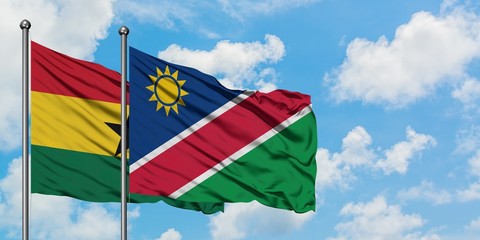 Ghana and Namibia flag waving in the wind against white cloudy blue sky together. Diplomacy concept, international relations.