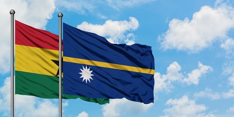 Ghana and Nauru flag waving in the wind against white cloudy blue sky together. Diplomacy concept, international relations.