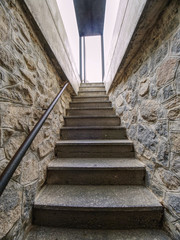 Interior of steep staircase leading to castle underground