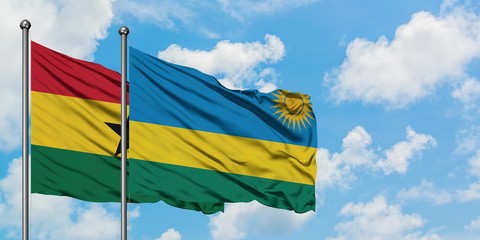 Ghana and Rwanda flag waving in the wind against white cloudy blue sky together. Diplomacy concept, international relations.