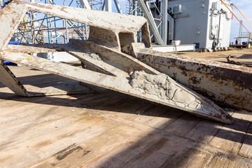 Anchor laid on deck of a construction barge at oil field