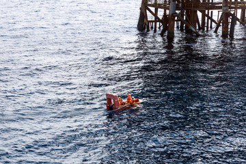Fast rescue craft deployed at oil field to assist in achor handling activities
