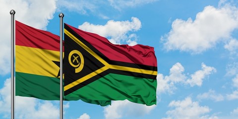 Ghana and Vanuatu flag waving in the wind against white cloudy blue sky together. Diplomacy concept, international relations.