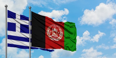 Greece and Afghanistan flag waving in the wind against white cloudy blue sky together. Diplomacy...