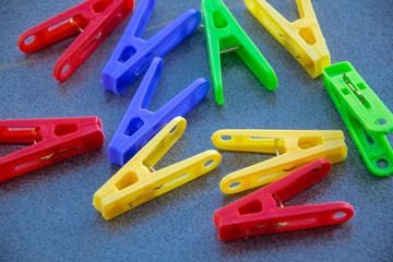 colorful clothes pegs on dark background