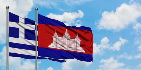 Greece and Cambodia flag waving in the wind against white cloudy blue sky together. Diplomacy concept, international relations.