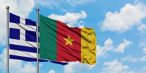 Greece and Cameroon flag waving in the wind against white cloudy blue sky together. Diplomacy concept, international relations.