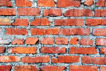 Brown brick wall. Empty horizontal background with old bricks and mortar
